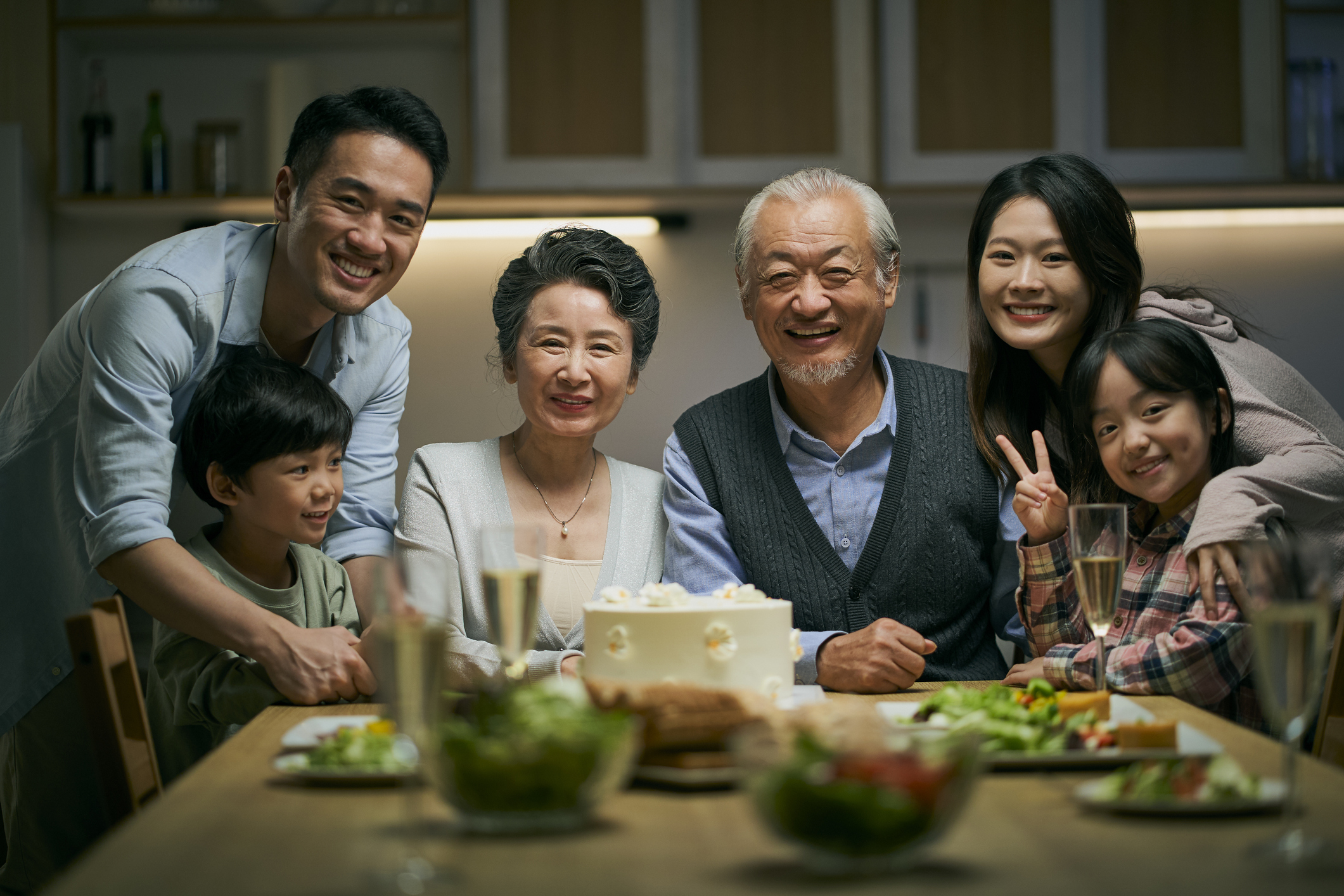 Three generation family having dinner in a dining room